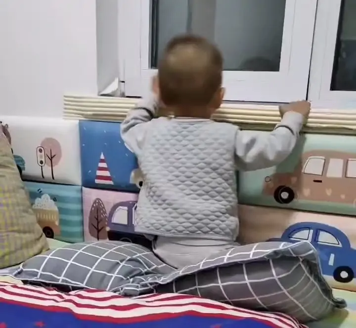 Day 238 after testicular yolk sac tumor surgery, my son Tuba looking out the window from the bed